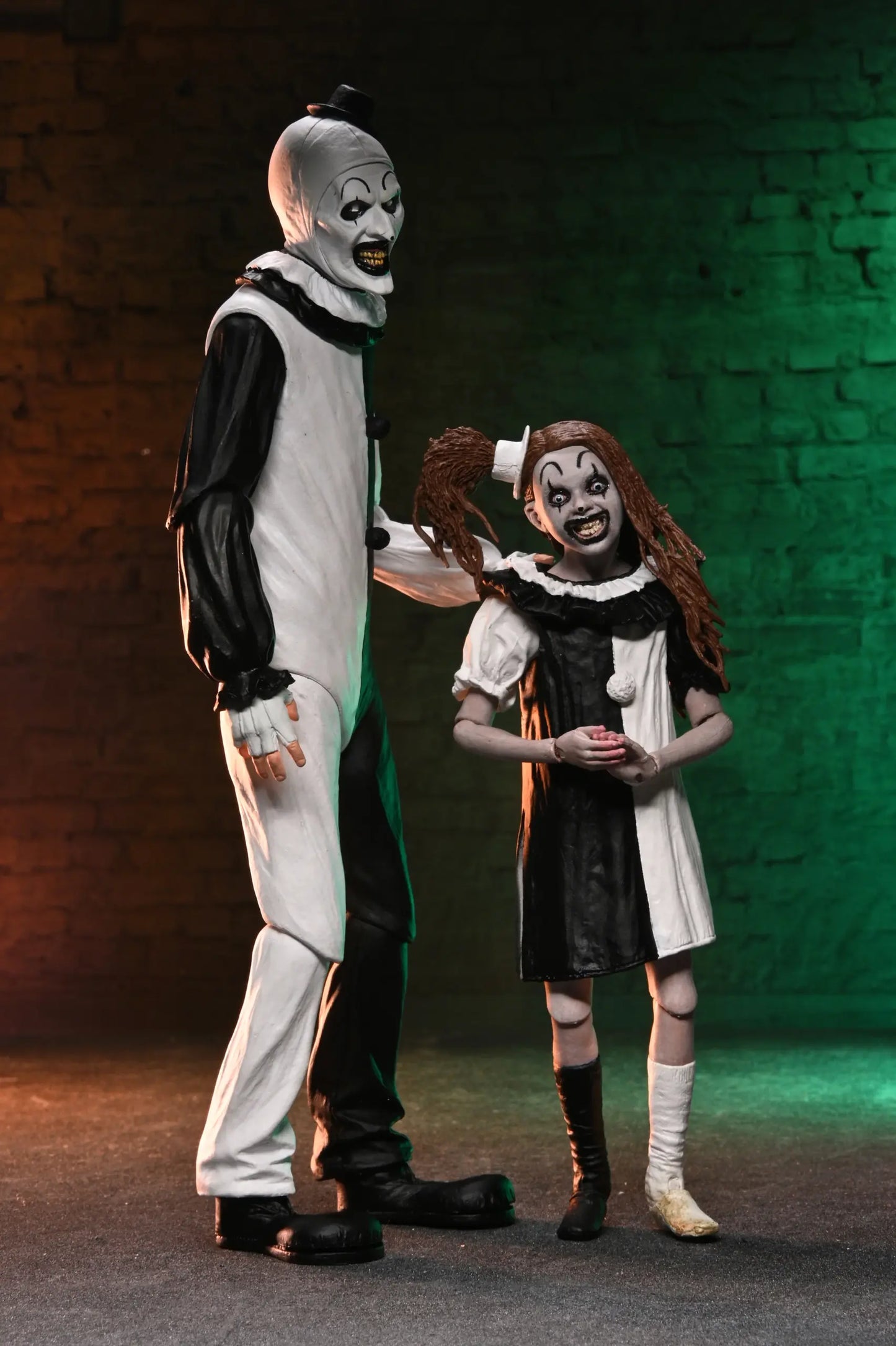 NECA Terrifier 2 – Art the Clown and Little Pale Girl Ultimate 7″ Scale Action Figure 2 Pack