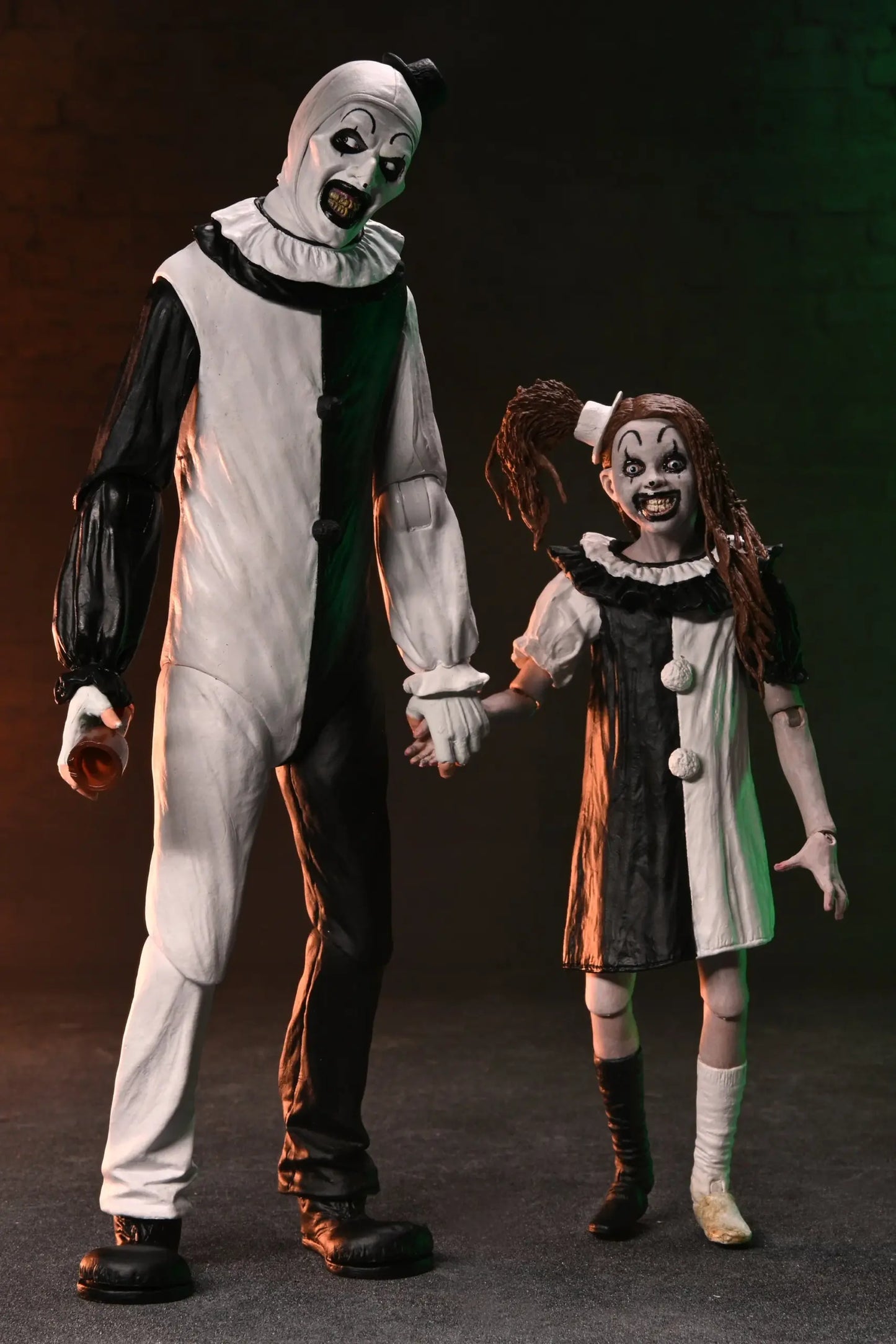 NECA Terrifier 2 – Art the Clown and Little Pale Girl Ultimate 7″ Scale Action Figure 2 Pack